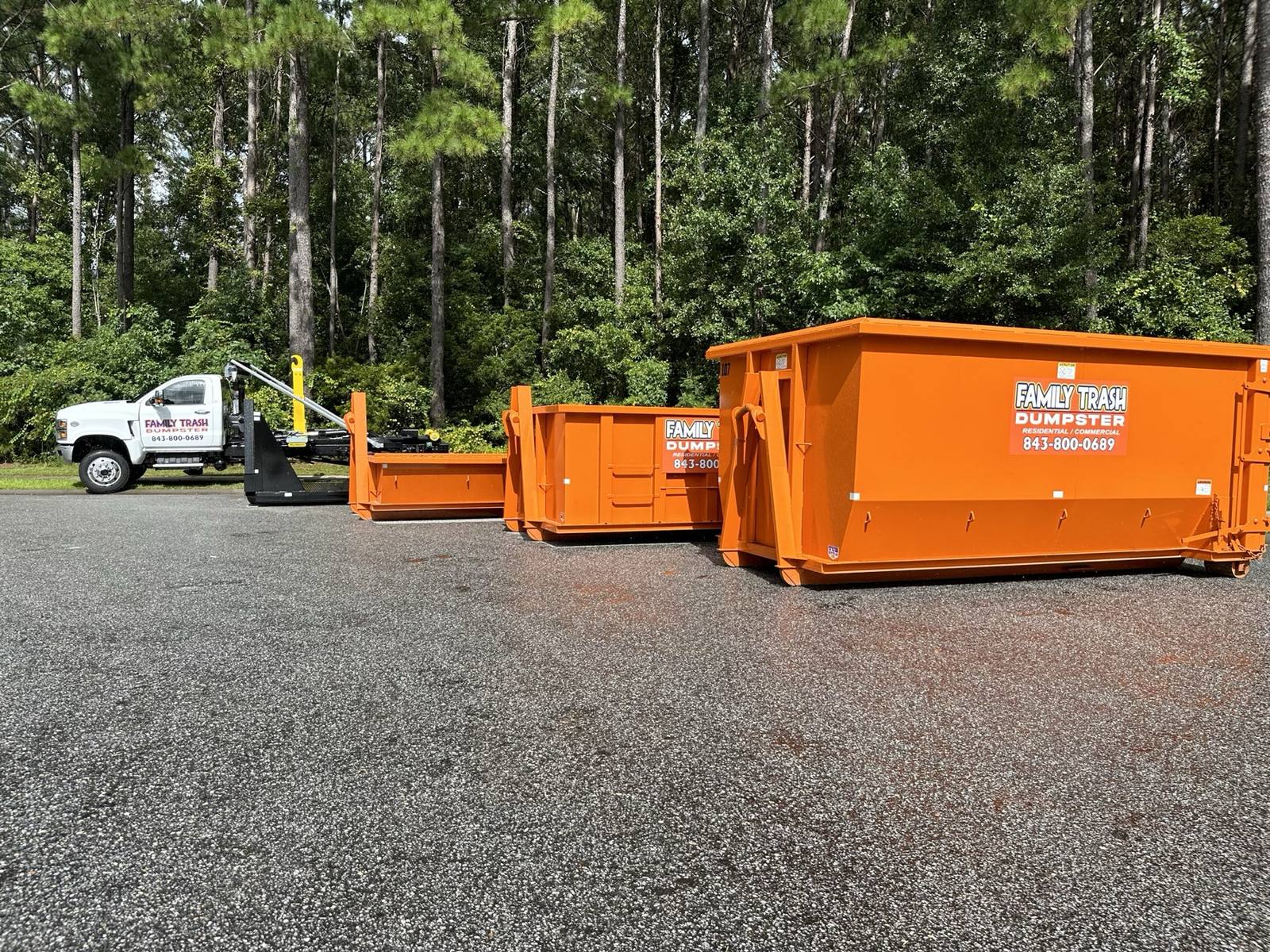 Family Trash dumpsters and roll-off truck in Charleston