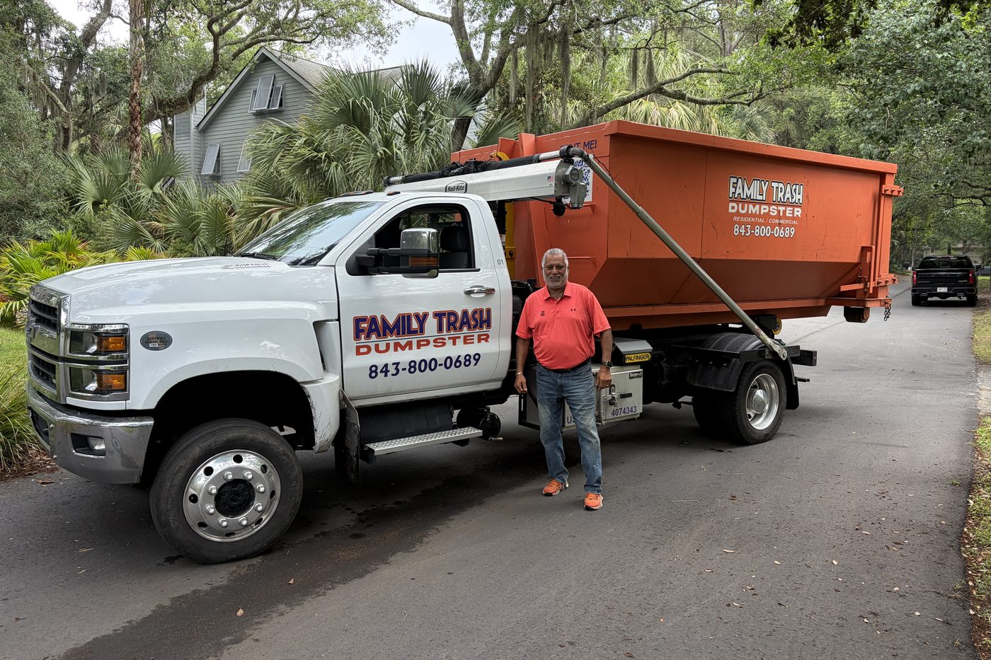 Tony Gentile, owner of Family Trash, with his dumpster truck in Charleston